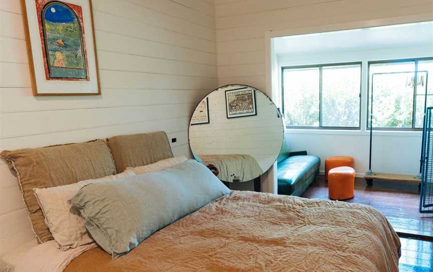 One of the four bedrooms at the Cromwell Farm House, complete with luxurious European linen bedding.