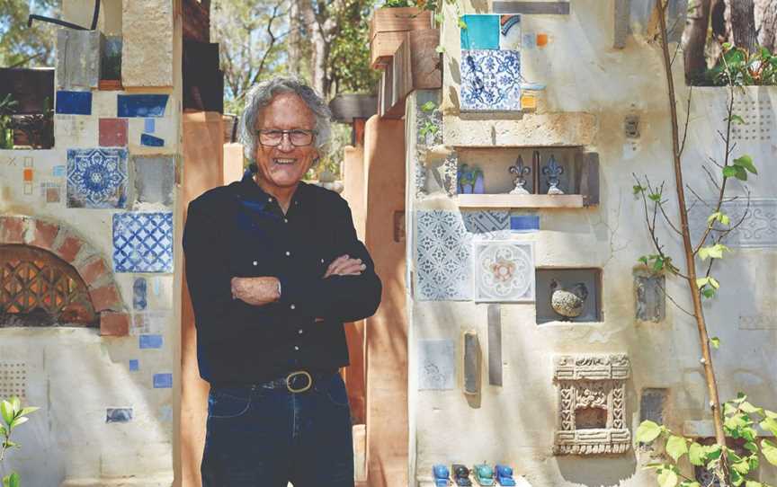 Leon Pericles stands in front of his Margaret River garden installation 'Moss Garden Ruins'