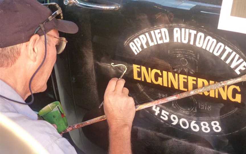 Painted logo with scrolls for restored Chevy ute.