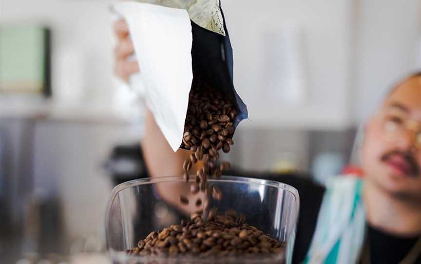 Cafe (North Street Store, Cottesloe) pouring Karvan coffee.