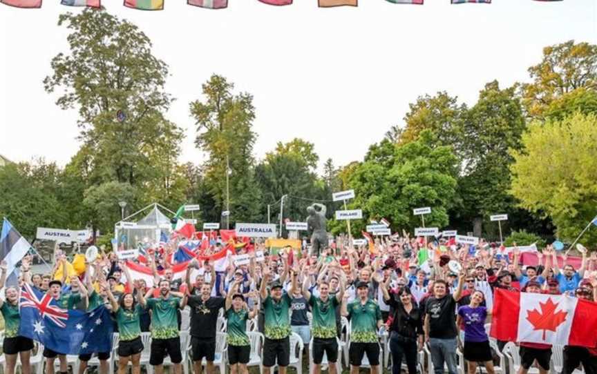 International teams celebrating disc golf