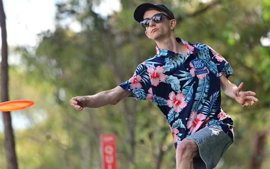 Man letting fly a disc.