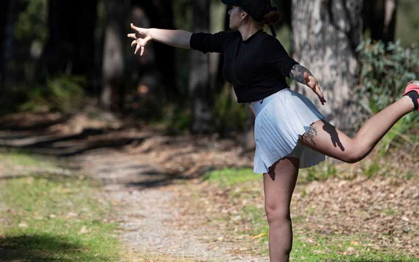 Women throwing a disc on the course.