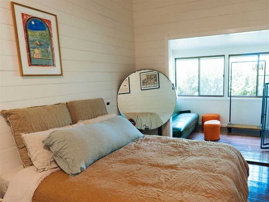 One of the four bedrooms at the Cromwell Farm House, complete with luxurious European linen bedding.