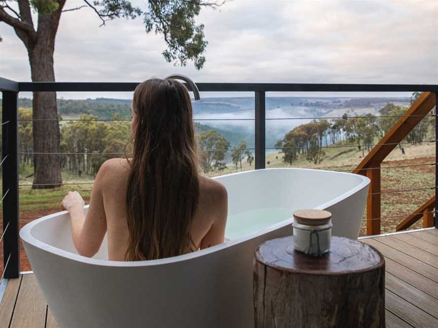 View from Yira tent to the misty valley from your own private stone bathtub.