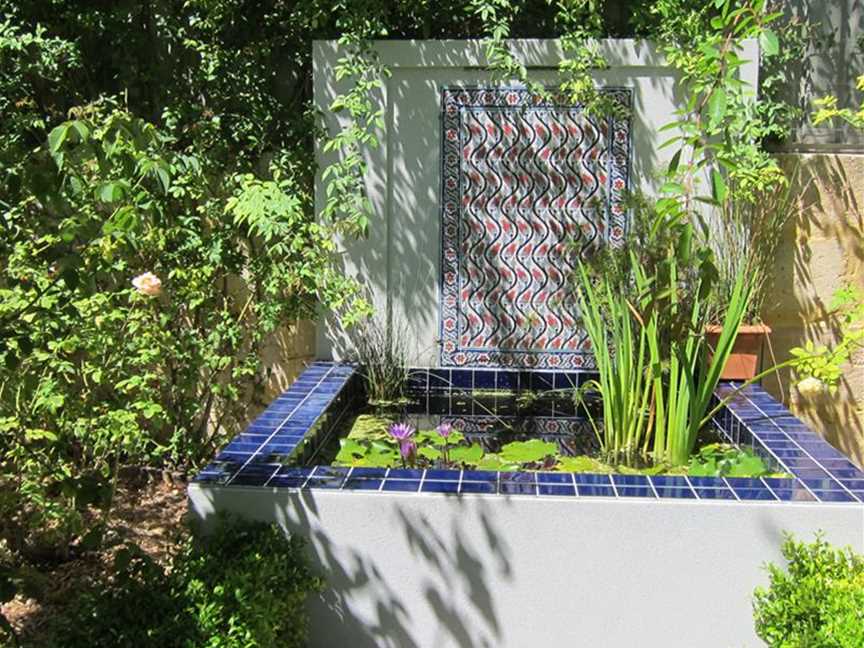 Waterlily pond/water wall with tiles bought  in Turkey by the owner