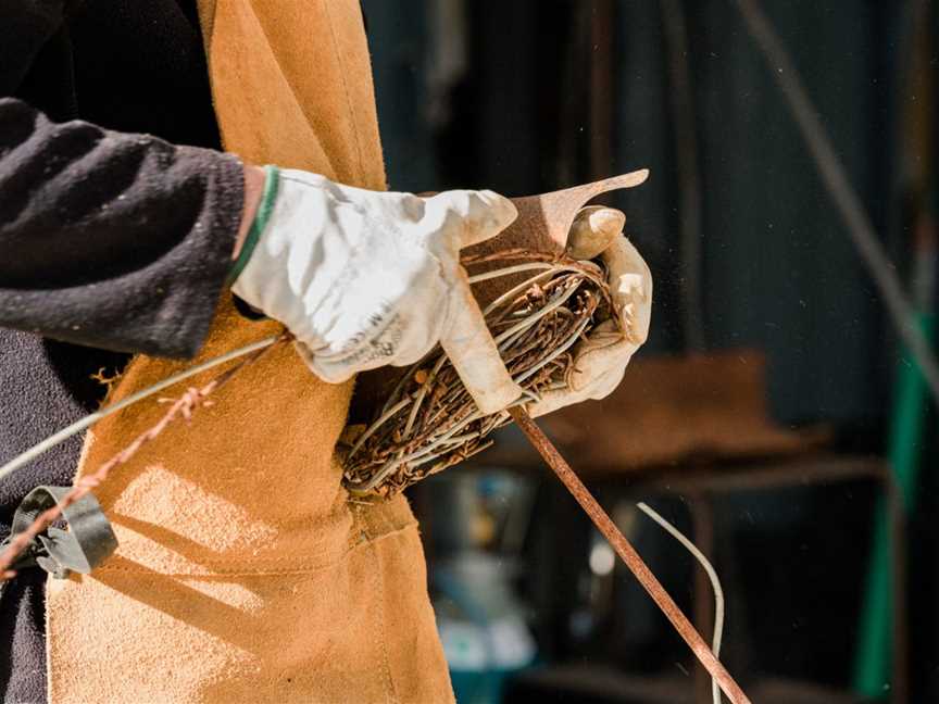 Ian Michael making a Lovebirds in a nest sculpture in his on-site workshop at Designer Dirt