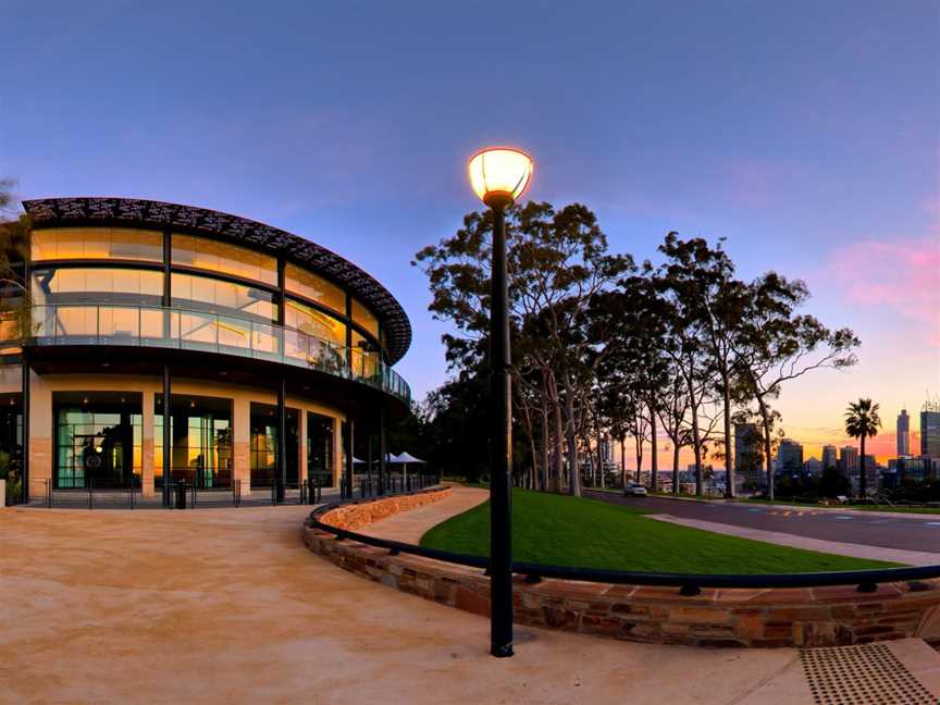 Fraser's Restaurant and tall gum trees to the city silhouetted by the glowing Western Australian sunset.