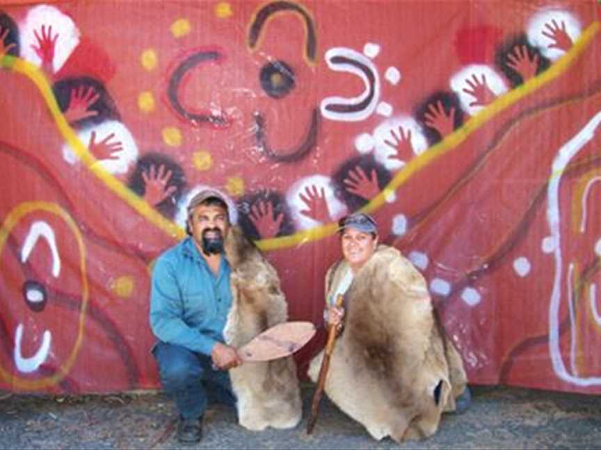 Karim Khan (a Wiillman and Kaneang man) wearing a booka (winter booka) holding a miro (spear thrower) and Phoebe Houghton (a Wiillman woman) dressed in a cloak holding a dowak (throwing stick). Image courtesy Ken Ninyette.