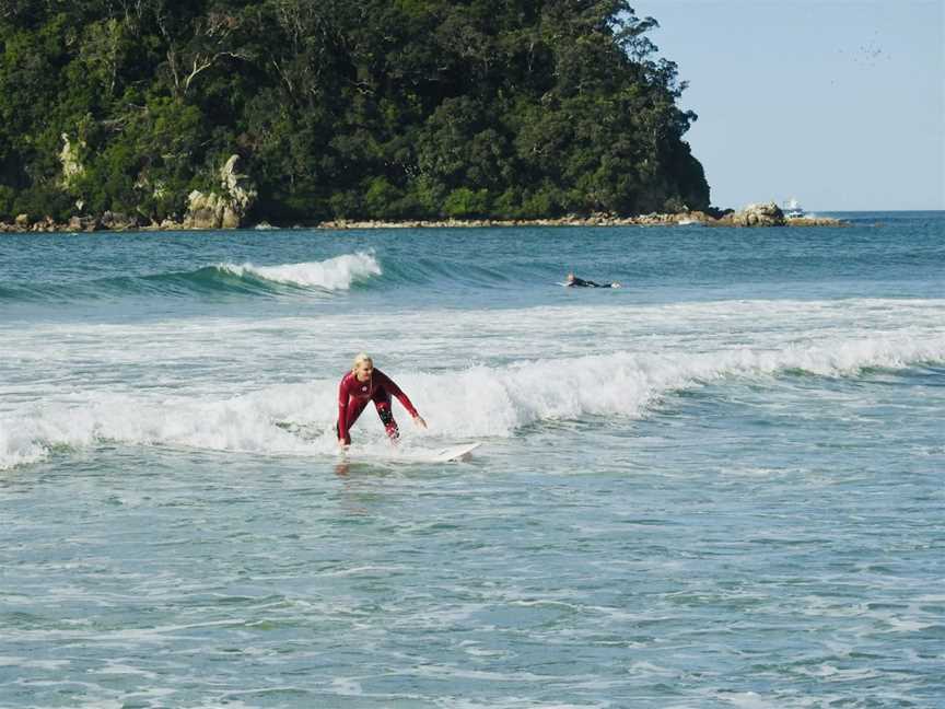 Learning to surf in a surf lesson in Mount Maunganui.