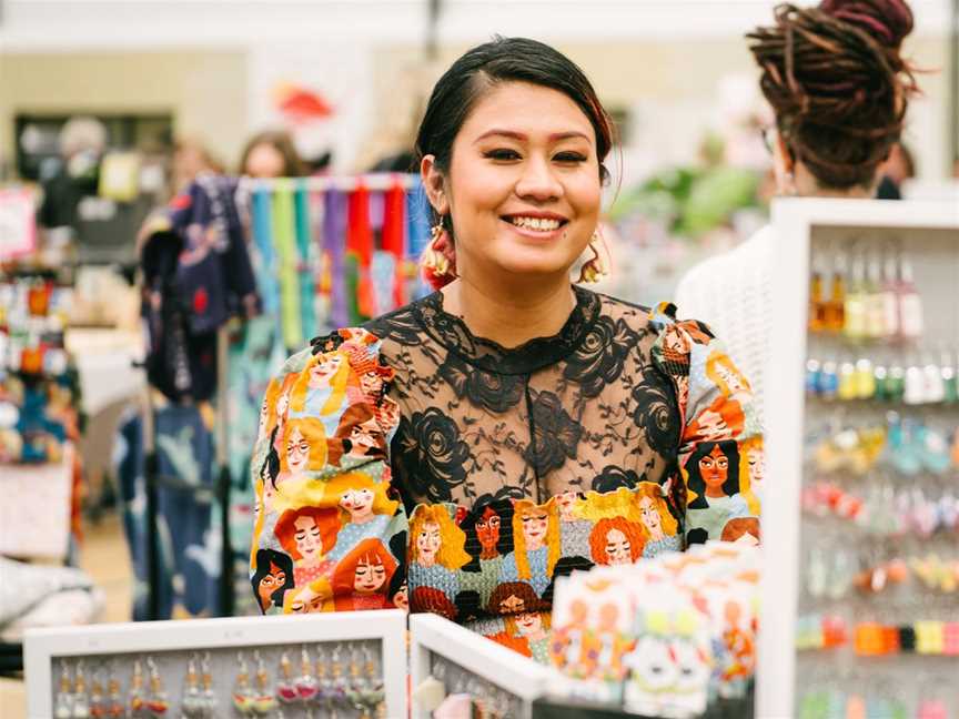 Beautiful artisan sitting behind her stall