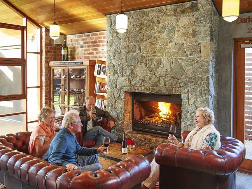 Guests enjoying the cosy fireside in our cellar door